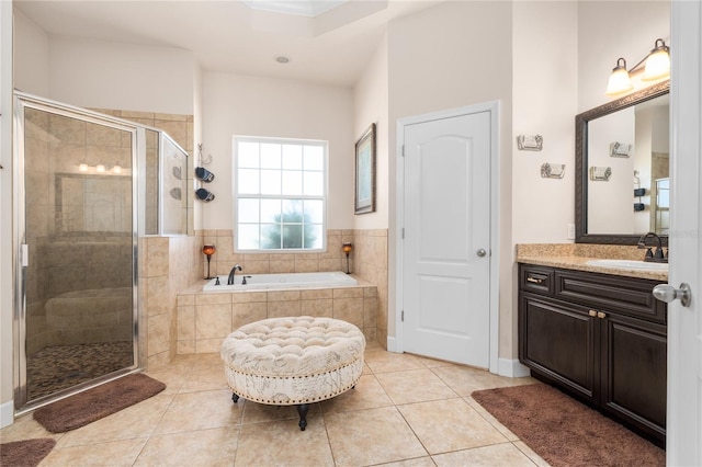 bathroom with vanity, shower with separate bathtub, and tile patterned flooring