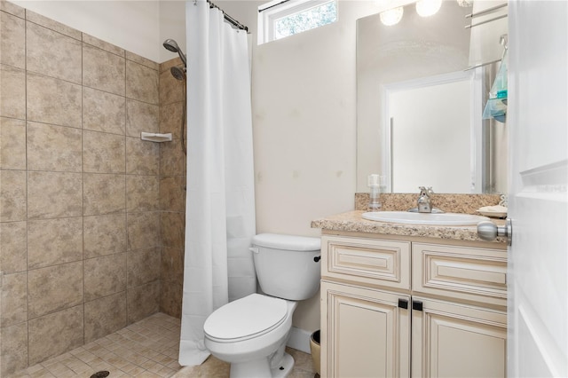 bathroom featuring toilet, walk in shower, and vanity