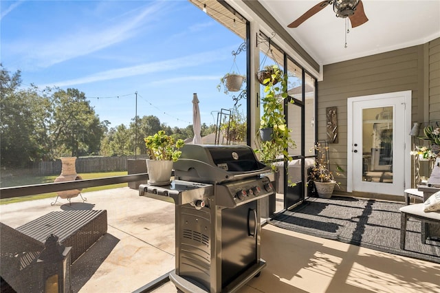 sunroom / solarium featuring ceiling fan