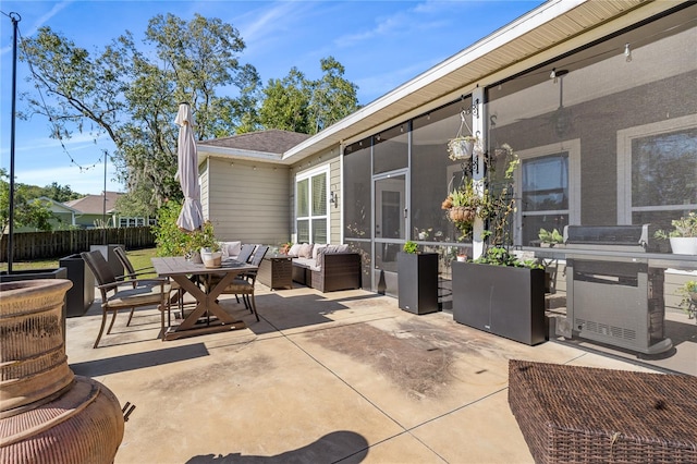 view of patio with outdoor lounge area and a sunroom