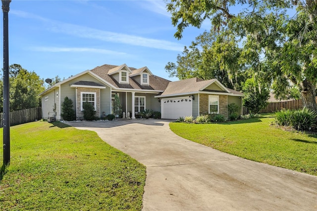 view of front of house with a front yard and a garage