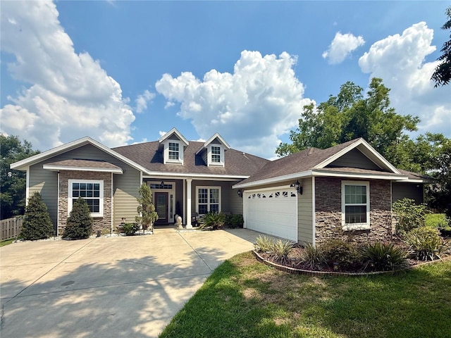 14825 NW 151st Ln, Alachua, FL 32615 - view of front of home with stone siding, concrete driveway, and a garage