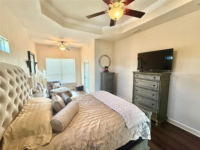 14825 NW 151st Ln, Alachua, FL 32615 - bedroom featuring a tray ceiling, dark wood-style floors, crown molding, multiple windows, and ceiling fan