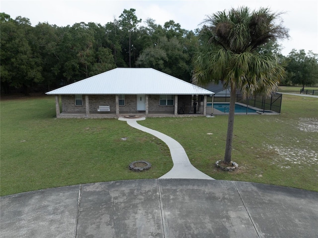 view of front facade with a patio area and a front lawn