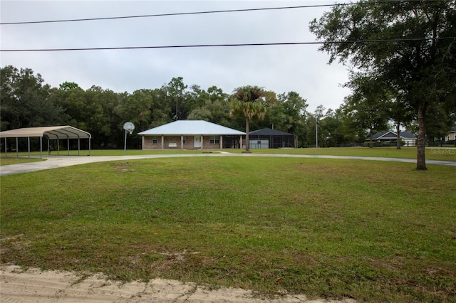 farmhouse inspired home with a front yard and a carport