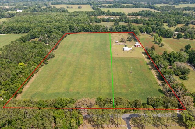 birds eye view of property featuring a rural view