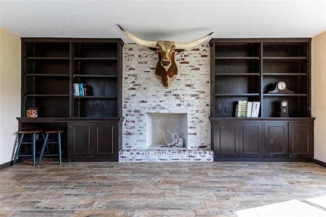 unfurnished living room featuring light wood-type flooring