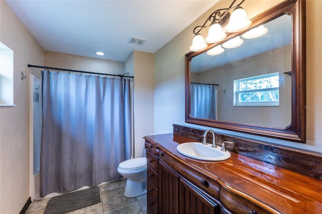 full bathroom featuring vanity, shower / bath combo, toilet, and tile patterned flooring