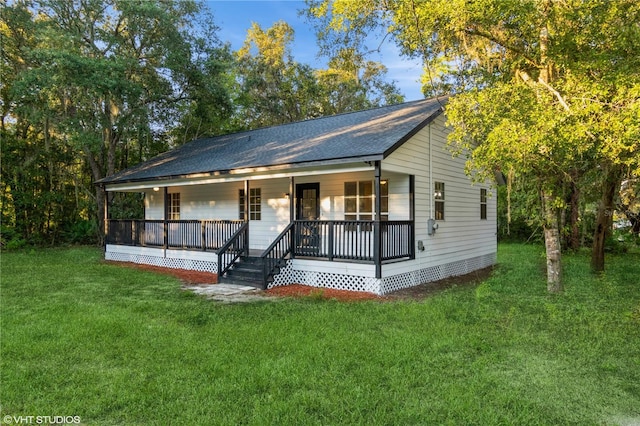 view of front of house featuring a front yard and a porch