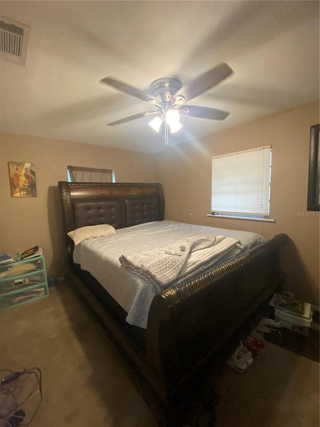 bedroom with ceiling fan and carpet floors