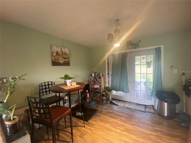 dining space with hardwood / wood-style flooring