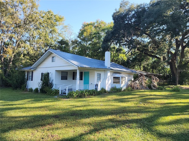 ranch-style home with a front lawn