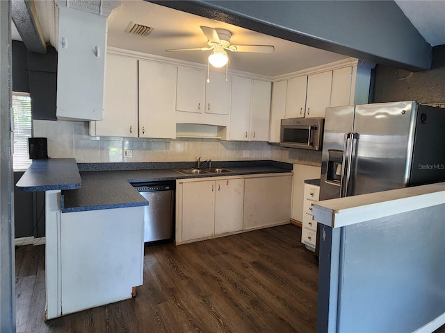 kitchen featuring white cabinetry, stainless steel appliances, sink, and dark hardwood / wood-style flooring