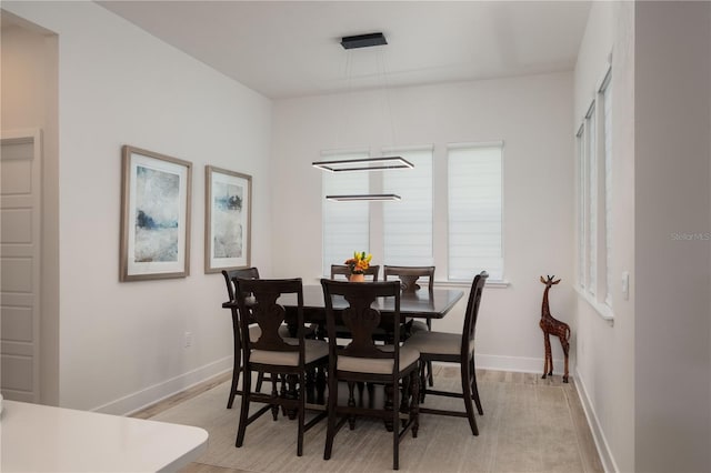 dining space featuring light hardwood / wood-style flooring