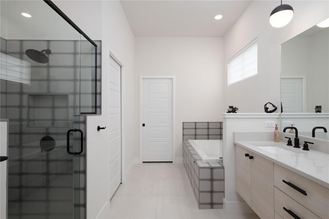 bathroom featuring tile patterned floors, vanity, and independent shower and bath