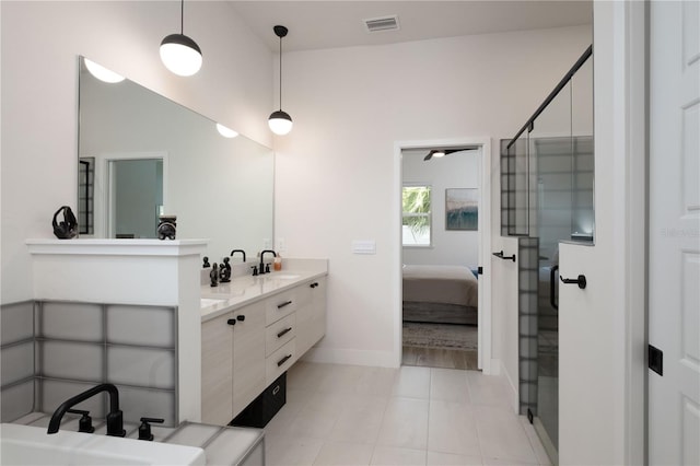 bathroom featuring tile patterned floors, a shower with door, vanity, and lofted ceiling