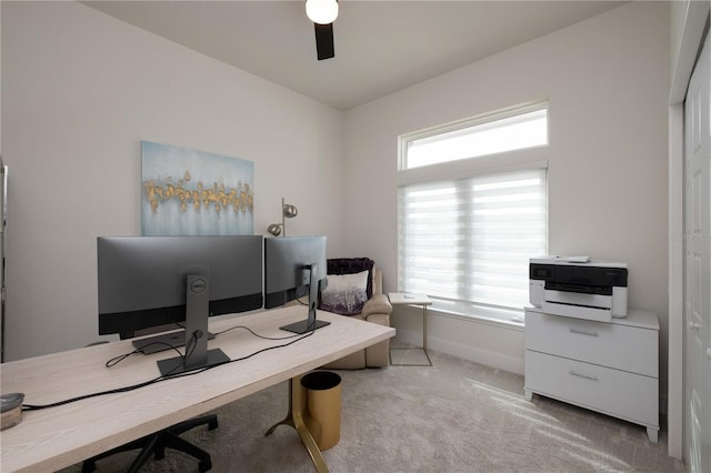 carpeted home office featuring a wealth of natural light and ceiling fan