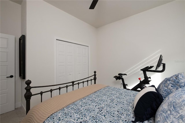 carpeted bedroom with a closet and ceiling fan