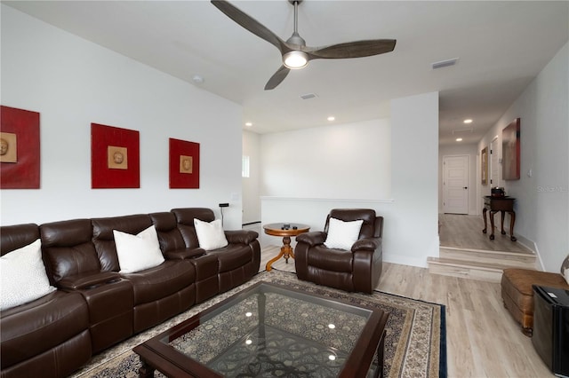 living room with ceiling fan and light hardwood / wood-style floors