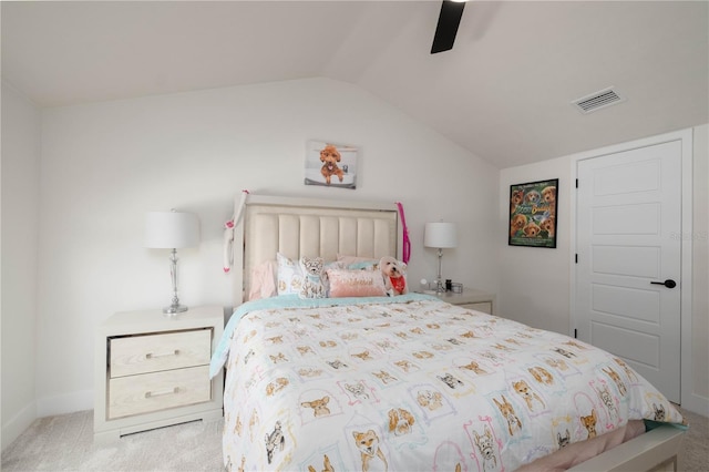 carpeted bedroom with vaulted ceiling and ceiling fan