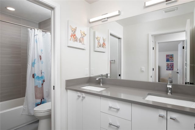 full bathroom with shower / bath combo, vanity, and toilet