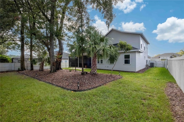 rear view of property featuring a lawn