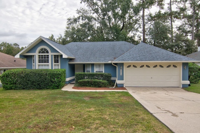 ranch-style house with a garage and a front lawn