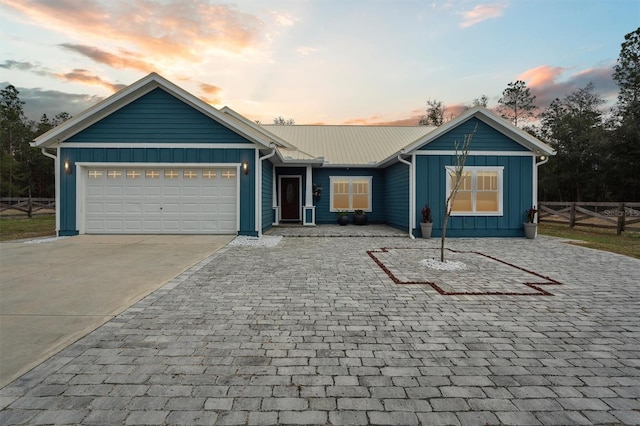 single story home with a garage