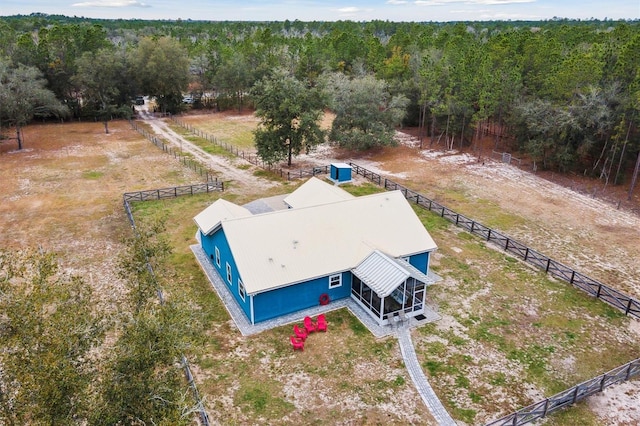 birds eye view of property featuring a rural view