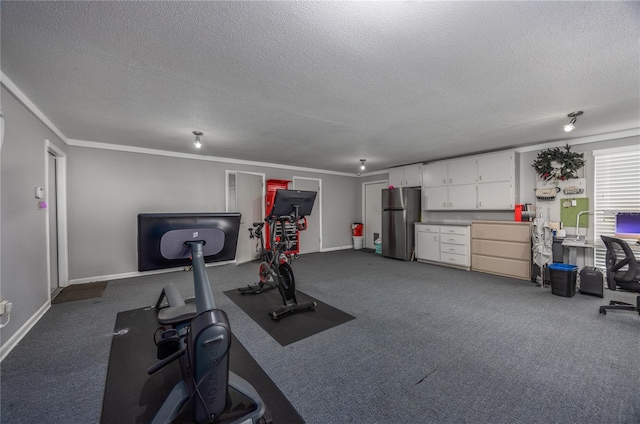 workout room featuring a textured ceiling, carpet floors, and crown molding