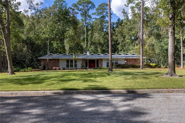 ranch-style house with a front lawn