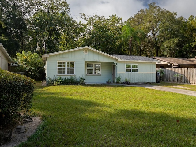 ranch-style home with a front yard