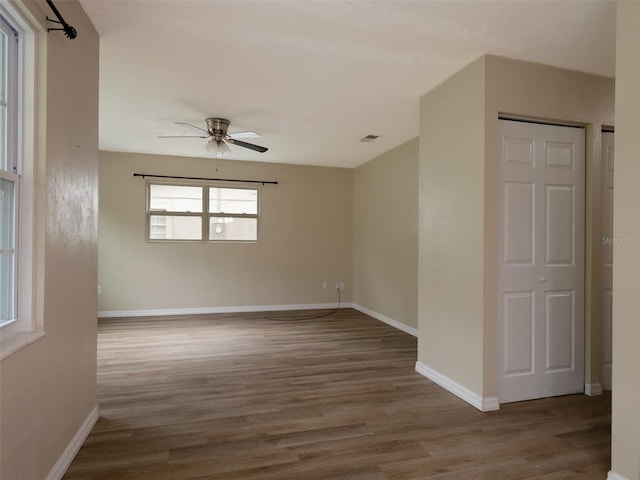 spare room featuring ceiling fan and wood-type flooring