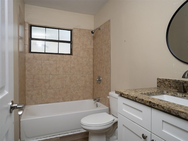 full bathroom featuring vanity, toilet, hardwood / wood-style flooring, and tiled shower / bath