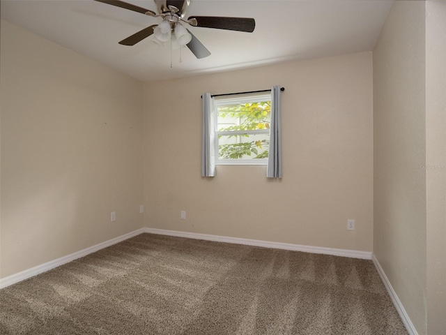 carpeted empty room featuring ceiling fan