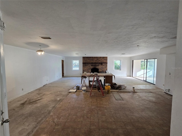 unfurnished living room featuring a healthy amount of sunlight