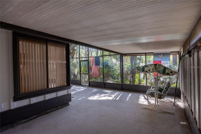 unfurnished sunroom featuring plenty of natural light