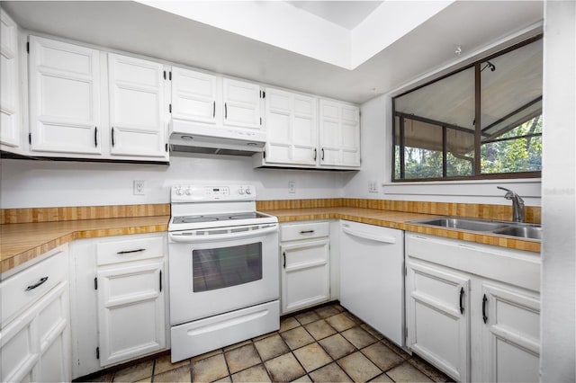 kitchen featuring white appliances, a sink, light countertops, white cabinets, and under cabinet range hood