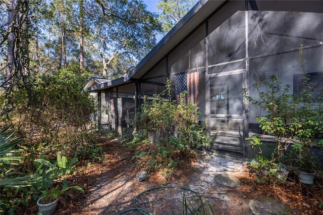 view of home's exterior featuring a sunroom