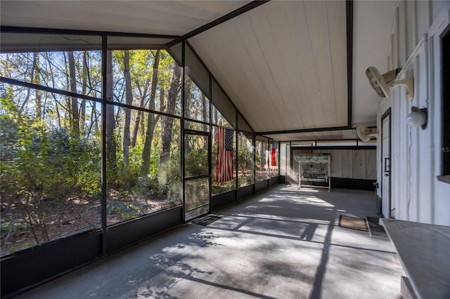 unfurnished sunroom with lofted ceiling and a healthy amount of sunlight