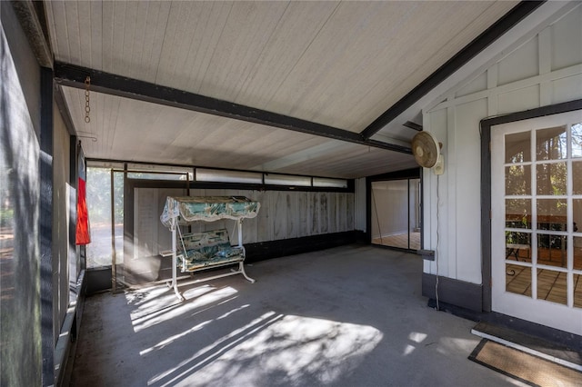 unfurnished sunroom with vaulted ceiling