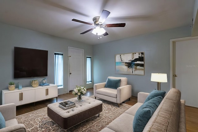 living room with dark hardwood / wood-style floors and ceiling fan