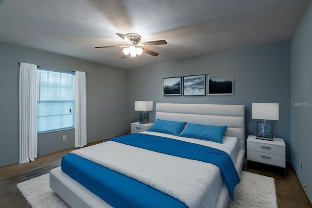 bedroom featuring dark wood-type flooring and ceiling fan