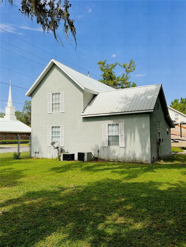 back of property with a yard