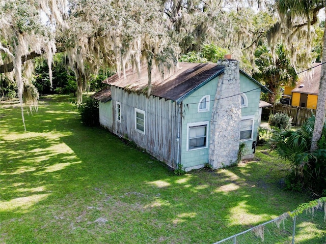 view of outdoor structure with a lawn