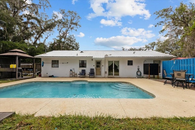 view of pool featuring a gazebo and a patio