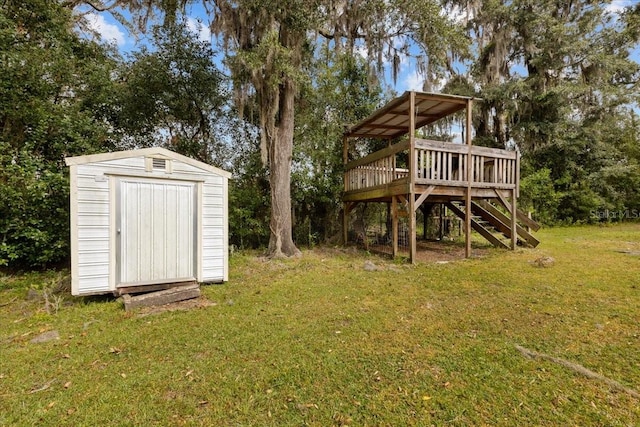 view of yard with a storage unit and a deck