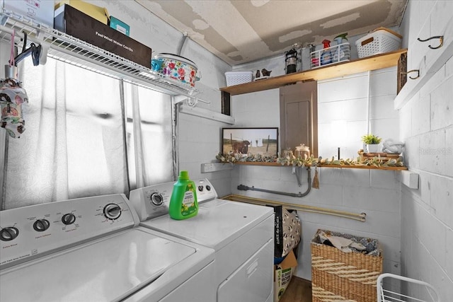 laundry area with washing machine and dryer