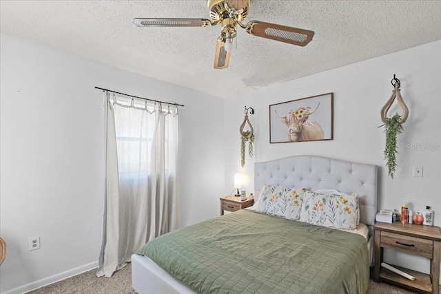 bedroom with ceiling fan, a textured ceiling, and carpet