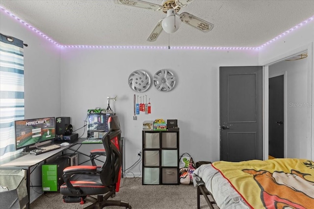 carpeted bedroom with ceiling fan and a textured ceiling